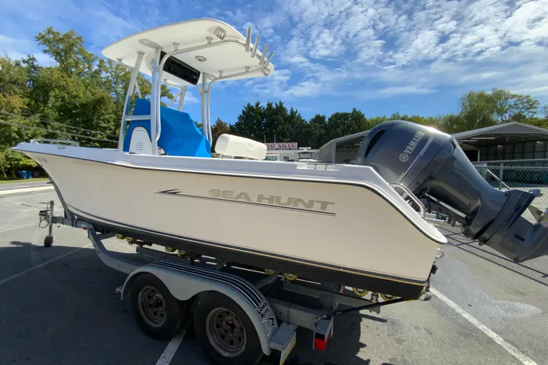 Slide: The Image of 2008 Sea Hunt Triton 220 boat on trailer with Yamaha outboard motor. - 7