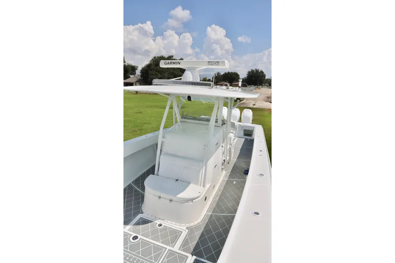 Slide: The Image of 2005 Venture 39 Open boat with Garmin equipment, docked on a sunny day. - 10