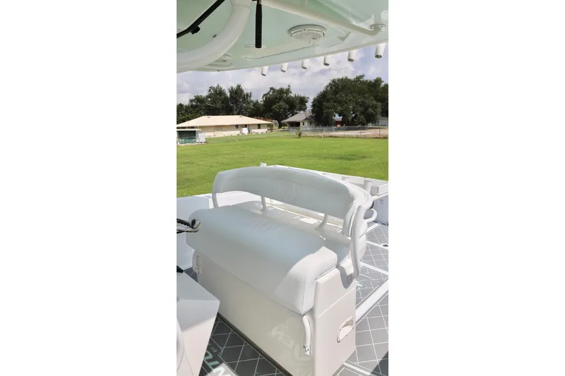 Slide: The Image of 2005 Venture 39 Open boat with white seating and outdoor view. - 15