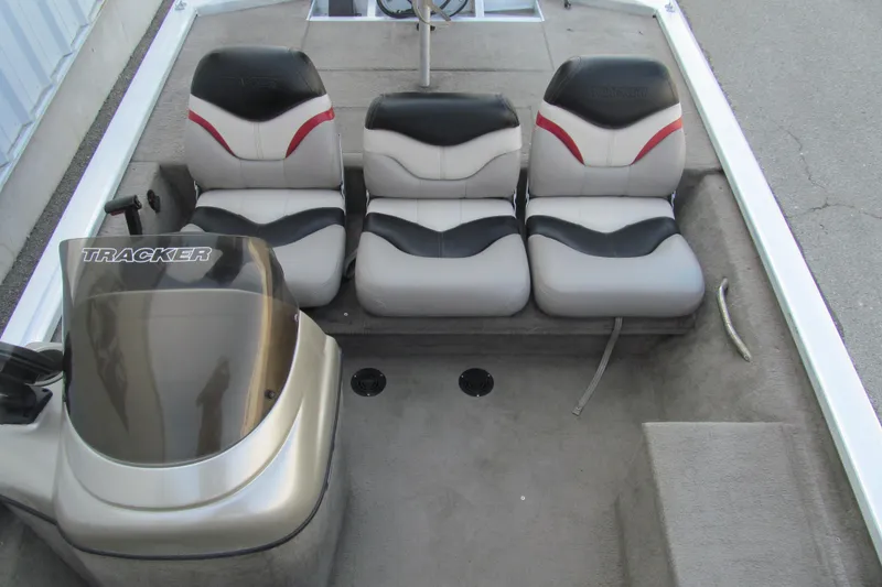 Slide: The Image of 2002 Tracker Pro Team 175 boat interior with three seats and steering console. - 10
