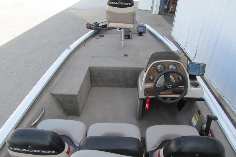 Slide: The Image of 2002 Tracker Pro Team 175 boat interior with steering console and seating. - 5