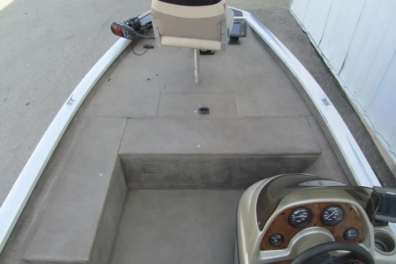 Slide: The Image of 2002 Tracker Pro Team 175 boat interior with steering console and seating. - 7