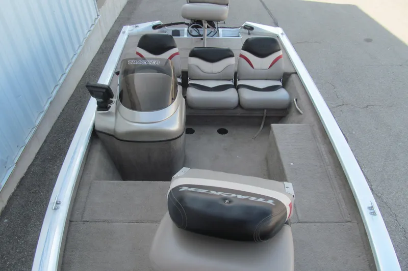 Slide: The Image of 2002 Tracker Pro Team 175 boat interior with seating and console. - 9