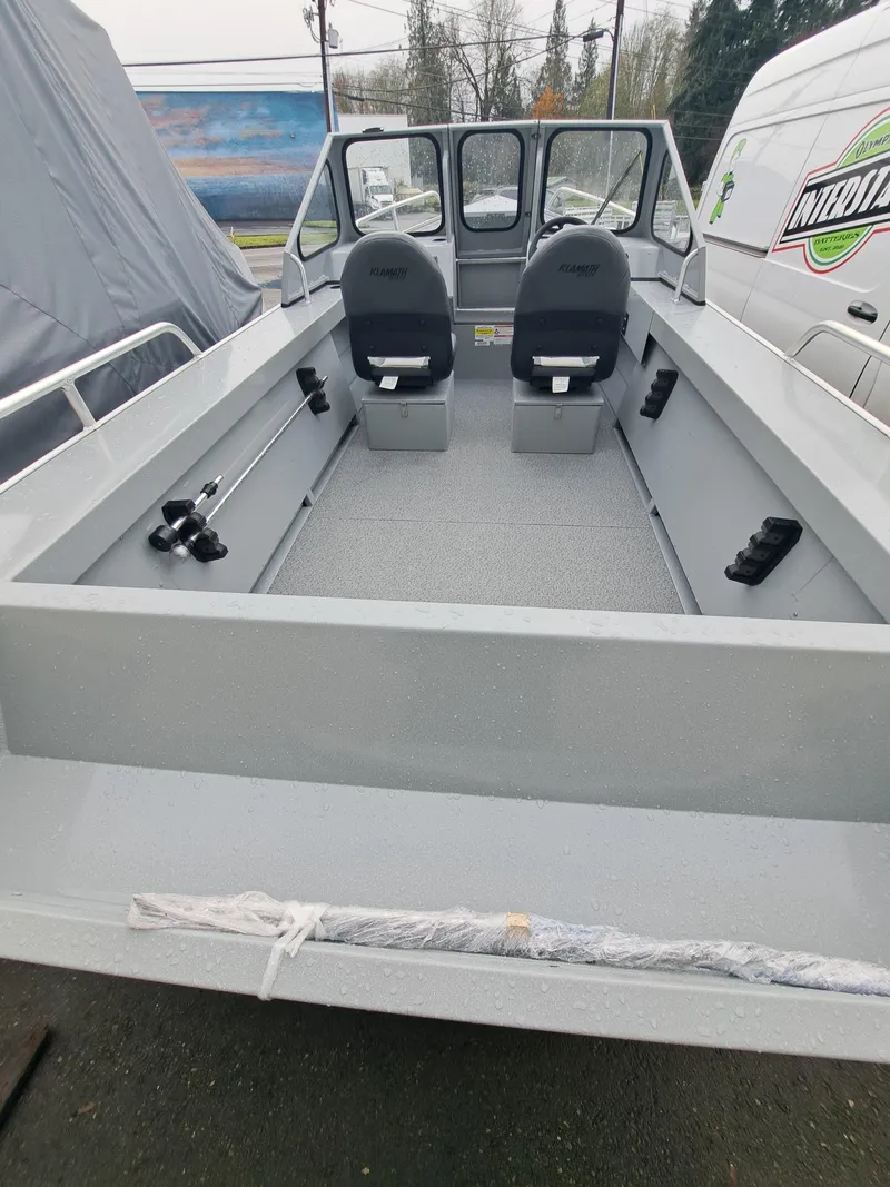 Slide: The Image of 2025 Klamath 18 OPW boat interior with two seats and spacious deck. - 3