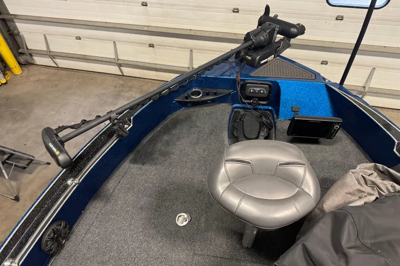 Slide: The Image of 2020 Nitro ZV20 Pro boat interior with trolling motor and fishing seat. - 12