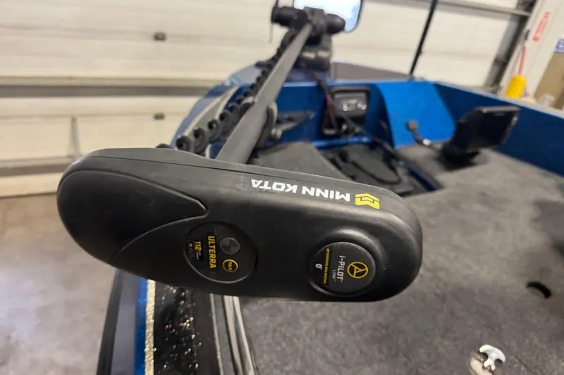 Slide: The Image of Minn Kota trolling motor on 2020 Nitro ZV20 Pro boat, garage setting. - 13