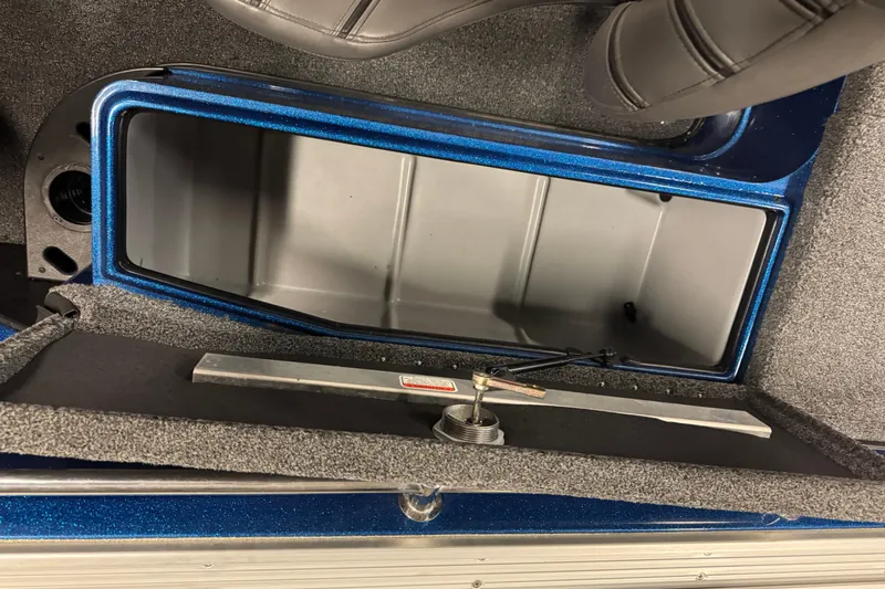 Slide: The Image of Open storage compartment in 2020 Nitro ZV20 Pro boat, featuring blue trim and gray interior. - 15