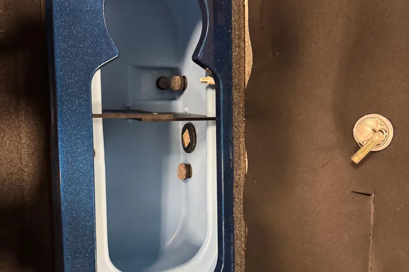 Slide: The Image of Interior view of a 2020 Nitro ZV20 Pro boat compartment with blue finish. - 16