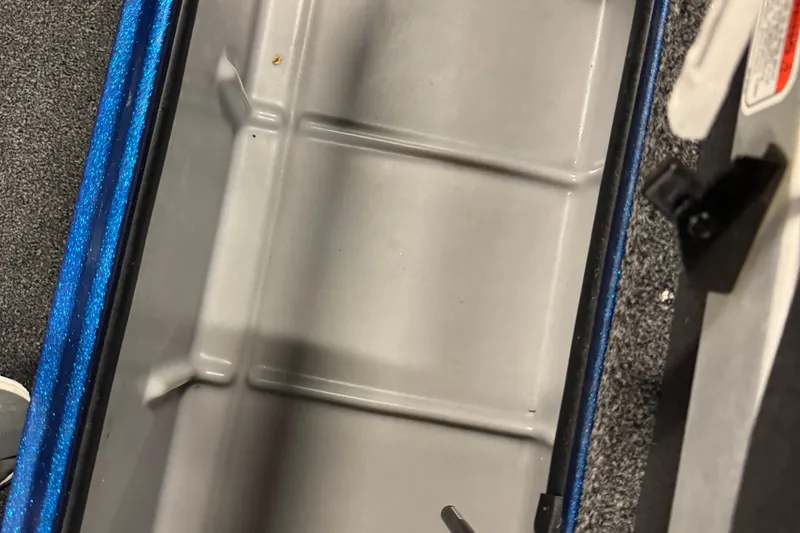 Slide: The Image of Interior storage compartment of 2020 Nitro ZV20 Pro boat, featuring gray and blue accents. - 17