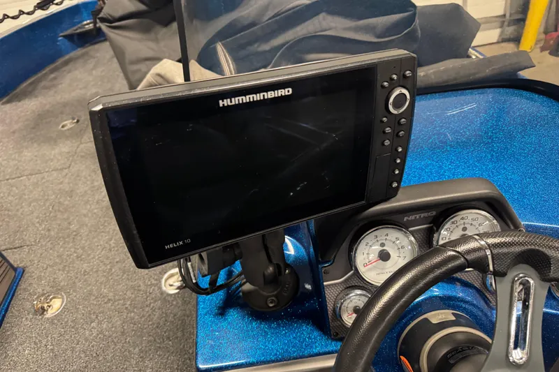 Slide: The Image of 2020 Nitro ZV20 Pro dashboard with Humminbird Helix 10 fish finder and gauges. - 9
