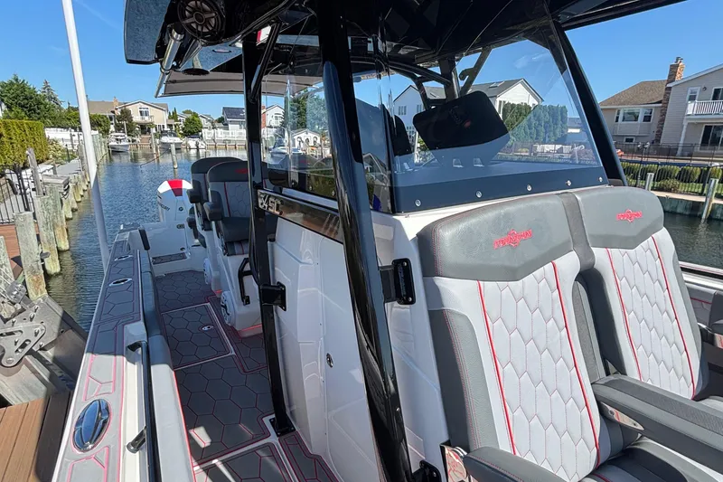 Slide: The Image of 2023 Fountain 34 SC boat interior with modern seating and sleek design. - 13