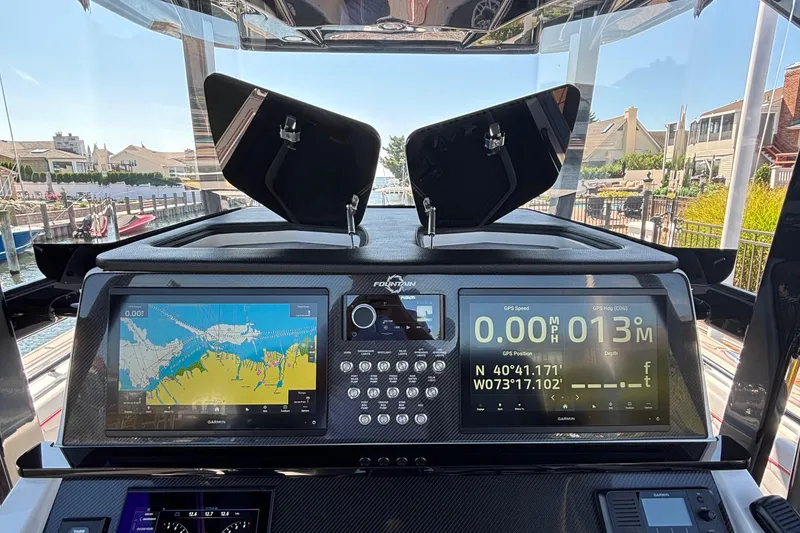 Slide: The Image of Dashboard of 2023 Fountain 34 SC boat with navigation and control displays. - 21