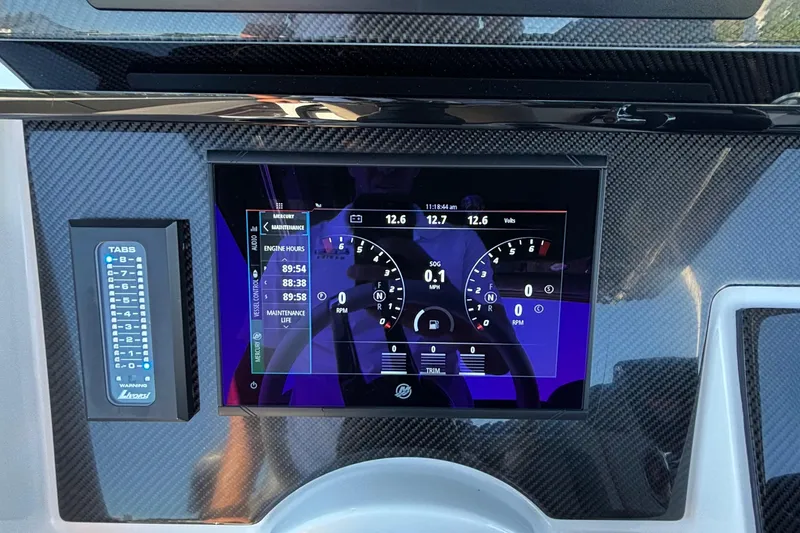 Slide: The Image of Dashboard of 2023 Fountain 34 SC boat with digital display and controls. - 22