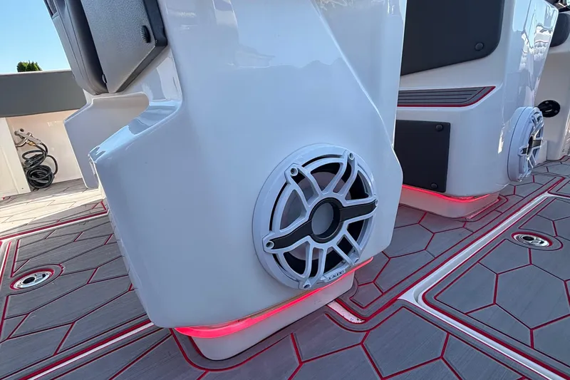 Slide: The Image of 2023 Fountain 34 SC boat interior with speakers and red LED lighting. - 35