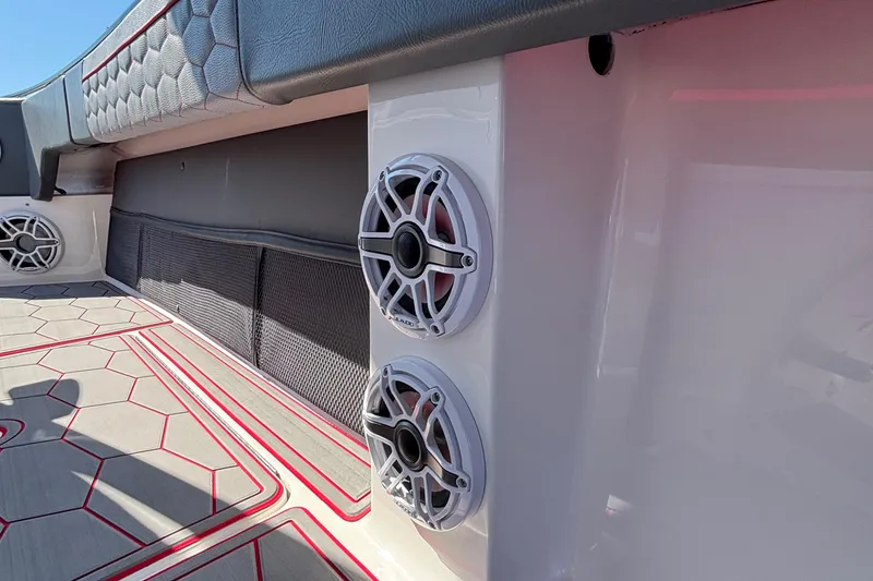 Slide: The Image of 2023 Fountain 34 SC boat interior with speakers and stylish flooring design. - 37