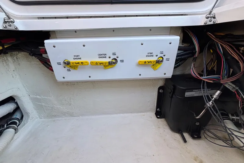 Slide: The Image of Control panel of a 2023 Fountain 34 SC boat with labeled engine switches. - 44