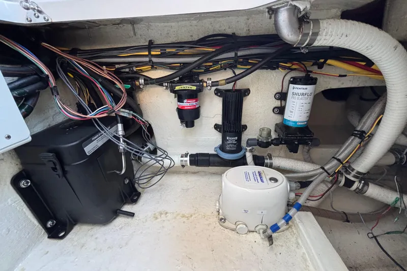 Slide: The Image of 2023 Fountain 34 SC boat wiring and plumbing system, featuring Shurflo Pro Blaster pump. - 46