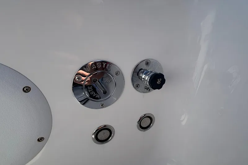 Slide: The Image of 2023 Fountain 34 SC boat waste outlet and fittings on white surface. - 48