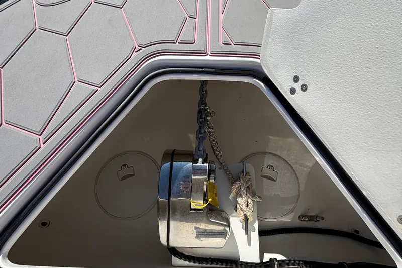 Slide: The Image of 2023 Fountain 34 SC boat anchor compartment with hexagonal pattern design. - 52