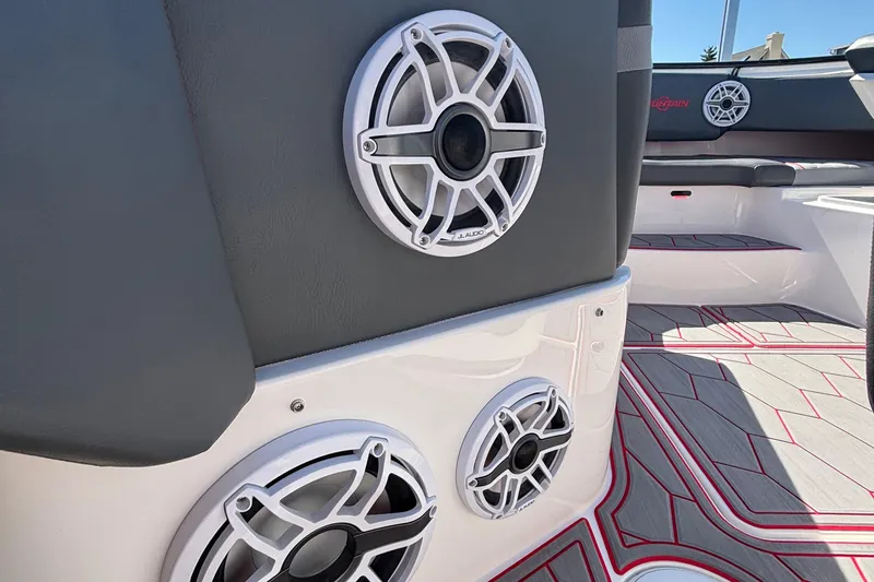 Slide: The Image of 2023 Fountain 34 SC boat interior with JL Audio speakers and stylish flooring. - 54