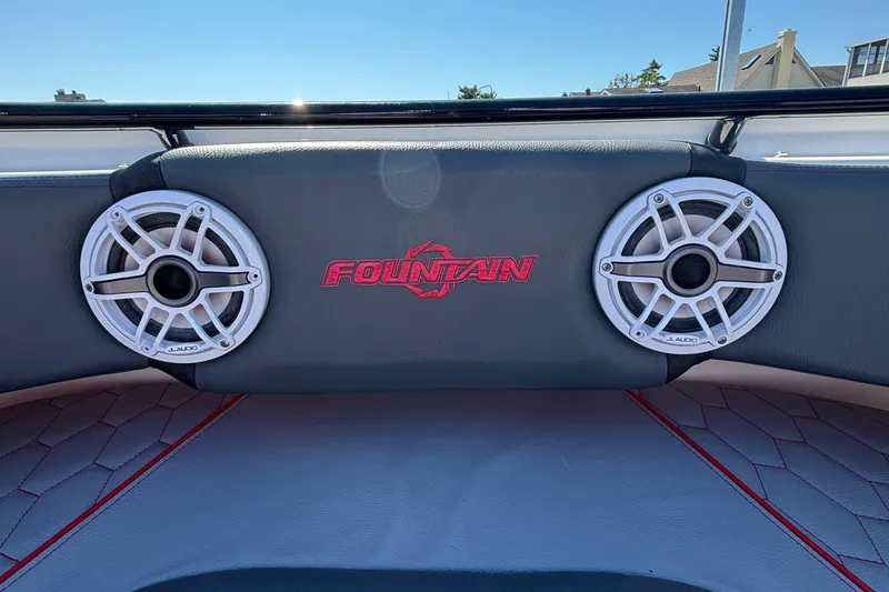 Slide: The Image of 2023 Fountain 34 SC boat interior with JL Audio speakers and logo. - 59