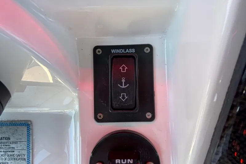 Slide: The Image of 2023 Fountain 34 SC windlass control switch on boat dashboard. - 62