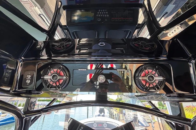 Slide: The Image of 2023 Fountain 34 SC boat interior with advanced audio system and sleek design. - 63