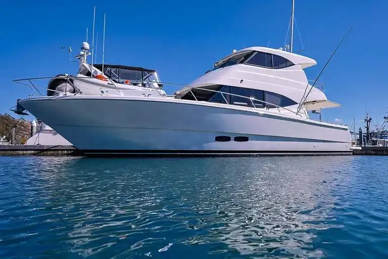 The Image of Luxury 2017 Maritimo M 51 yacht docked in a marina under clear blue skies. - 0