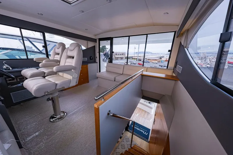 Slide: The Image of Luxurious interior of 2017 Maritimo M 51 yacht with plush seating and panoramic windows. - 15