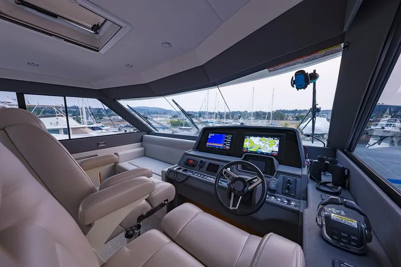 Slide: The Image of 2017 Maritimo M 51 yacht helm with modern navigation systems and luxurious seating. - 18