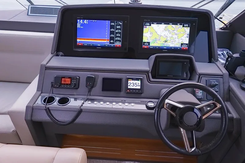 Slide: The Image of Helm of 2017 Maritimo M 51 yacht with navigation screens and controls. - 19