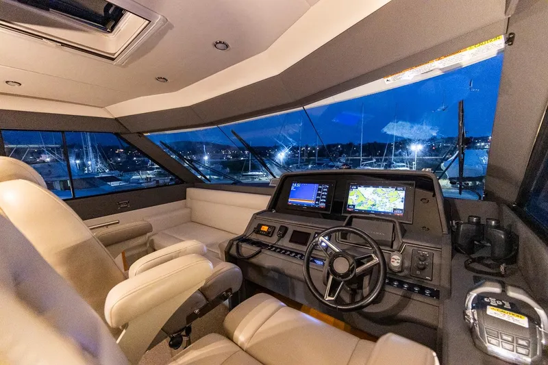 Slide: The Image of Luxurious 2017 Maritimo M 51 yacht cockpit with modern navigation systems at night. - 20