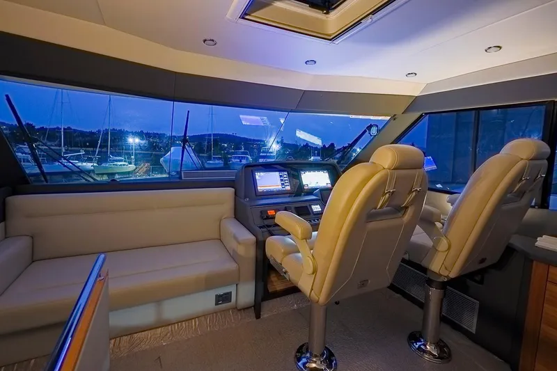 Slide: The Image of Luxurious 2017 Maritimo M 51 yacht interior with plush seating and advanced navigation controls. - 21