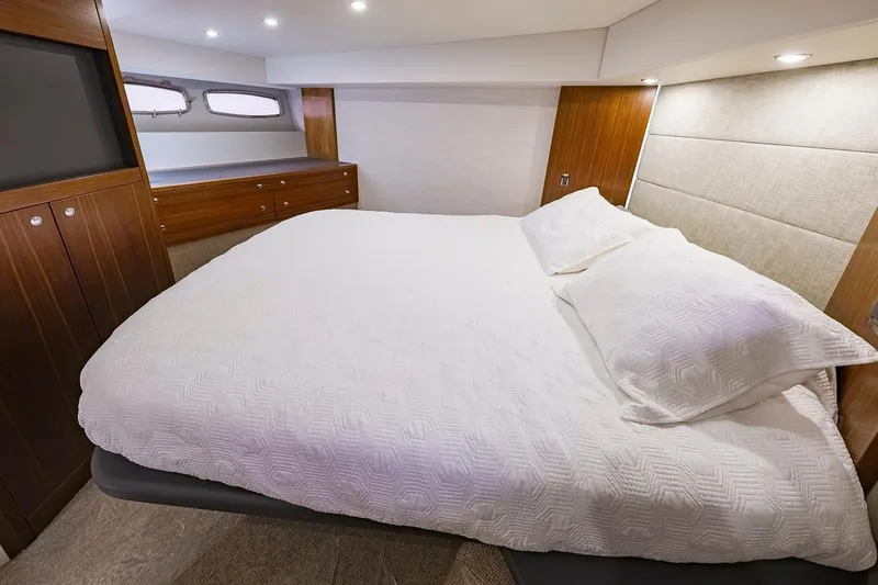 Slide: The Image of Luxurious bedroom interior of 2017 Maritimo M 51 yacht with elegant wood finishes. - 24