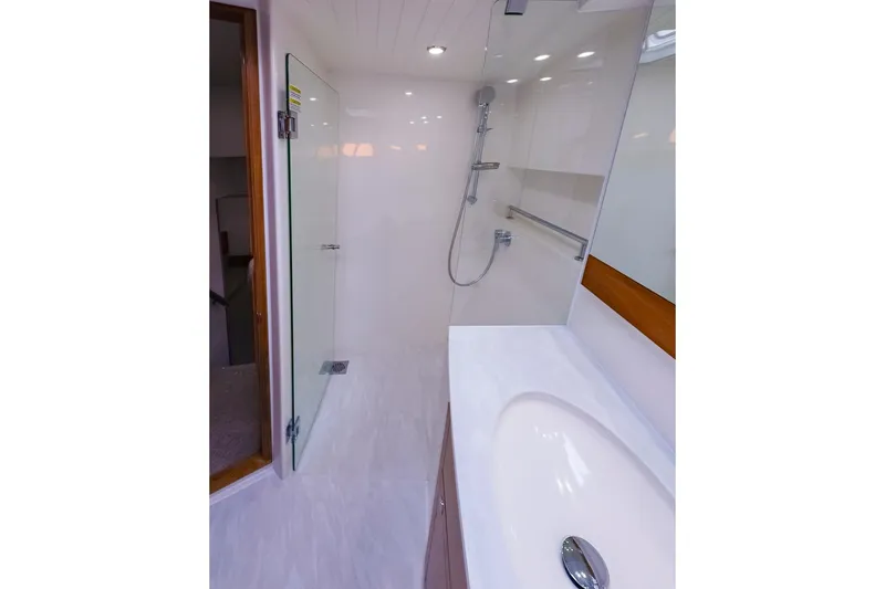 Slide: The Image of 2017 Maritimo M 51 yacht bathroom with modern shower and sleek sink design. - 26