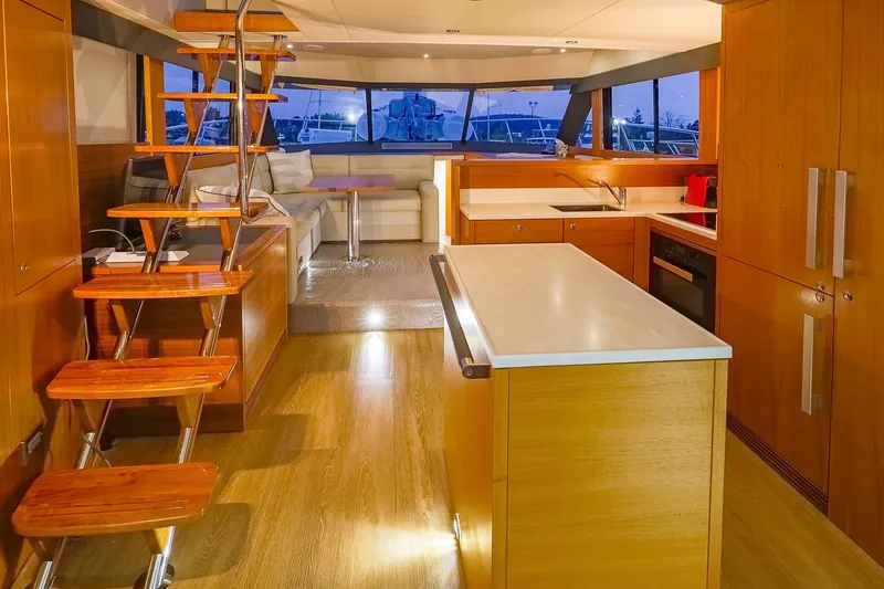 Slide: The Image of Luxurious interior of 2017 Maritimo M 51 yacht with modern kitchen and elegant staircase. - 31