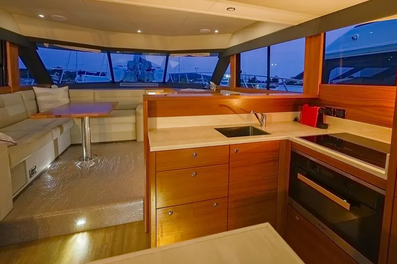 Slide: The Image of Luxurious interior of 2017 Maritimo M 51 yacht with modern kitchen and seating area. - 32