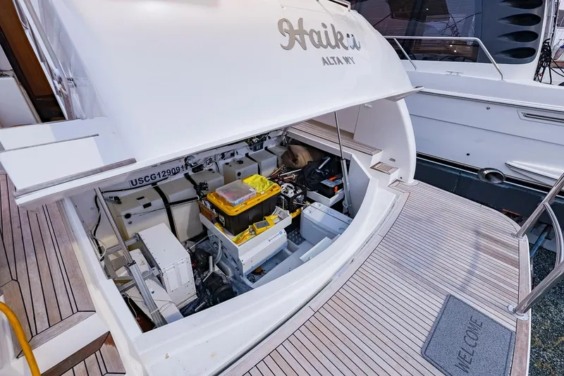 Slide: The Image of 2017 Maritimo M 51 yacht with open engine compartment, showcasing equipment and storage. - 33