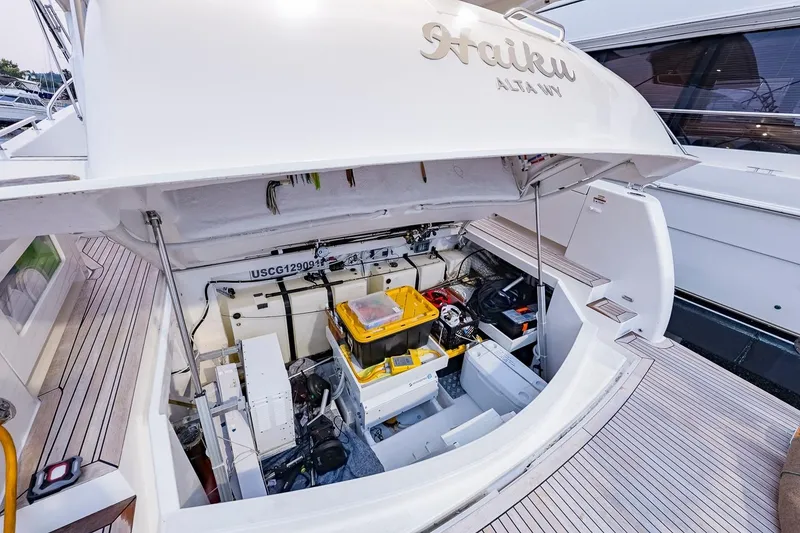 Slide: The Image of 2017 Maritimo M 51 yacht engine compartment with open hatch and visible equipment. - 34