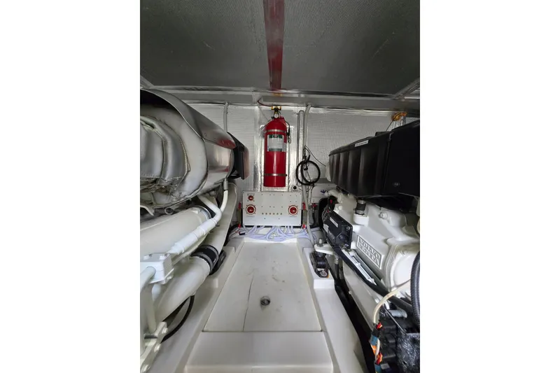 Slide: The Image of Engine room of 2017 Maritimo M 51 yacht with fire extinguisher and machinery. - 39