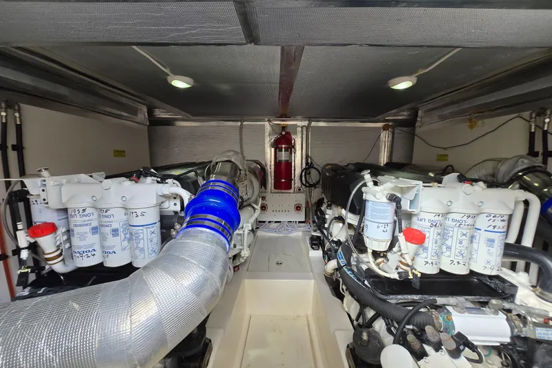 Slide: The Image of Engine room of 2017 Maritimo M 51 yacht with dual engines and fire extinguisher. - 42