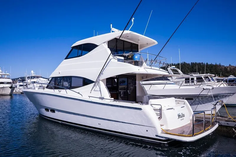 Slide: The Image of Luxury 2017 Maritimo M 51 yacht docked in marina under clear blue sky. - 6