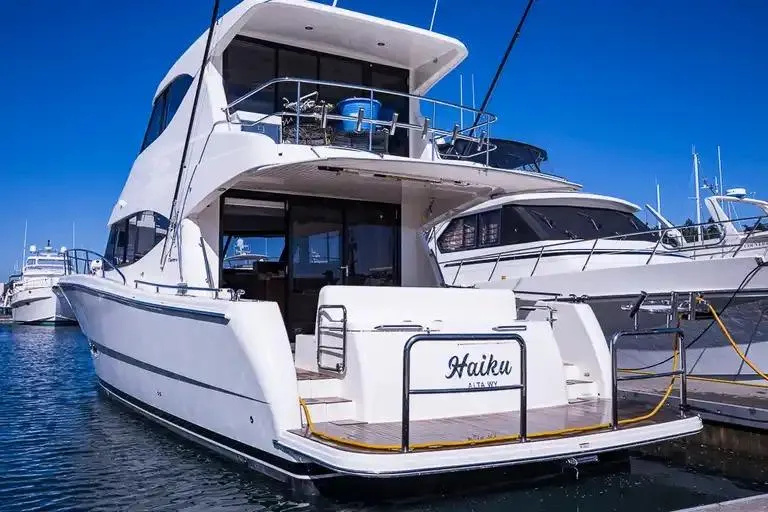 Slide: The Image of 2017 Maritimo M 51 yacht docked at marina, sleek design, sunny day. - 7