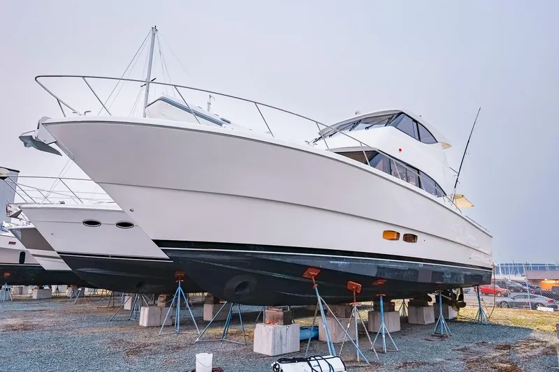 Slide: The Image of 2017 Maritimo M 51 yacht on stands, displayed outdoors. - 8