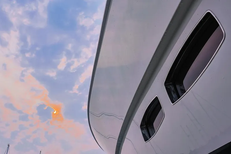 Slide: The Image of 2017 Maritimo M 51 yacht against a colorful sky backdrop. - 9