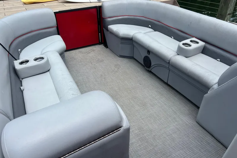 Slide: The Image of 2019 Bentley Pontoons 243 Cruise interior with gray seating and cup holders. - 7