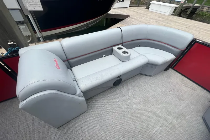 Slide: The Image of 2019 Bentley Pontoons 243 Cruise interior with gray seating and cup holders. - 9
