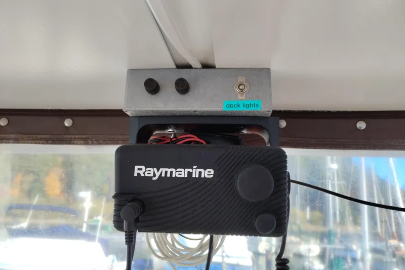 Slide: The Image of Raymarine device and deck lights switch on 1988 Monk 36 Aft Cabin boat. - 14