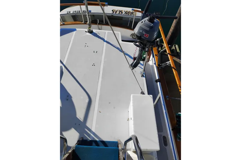 Slide: The Image of 1988 Monk 36 Aft Cabin boat deck with outboard motor and railing. - 20