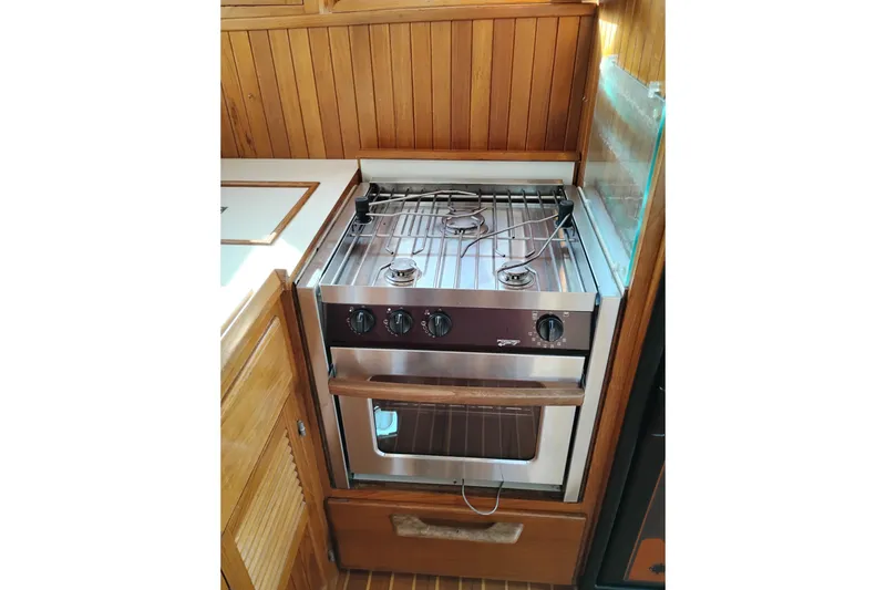 Slide: The Image of Stainless steel stove in 1988 Monk 36 Aft Cabin yacht kitchen. - 27